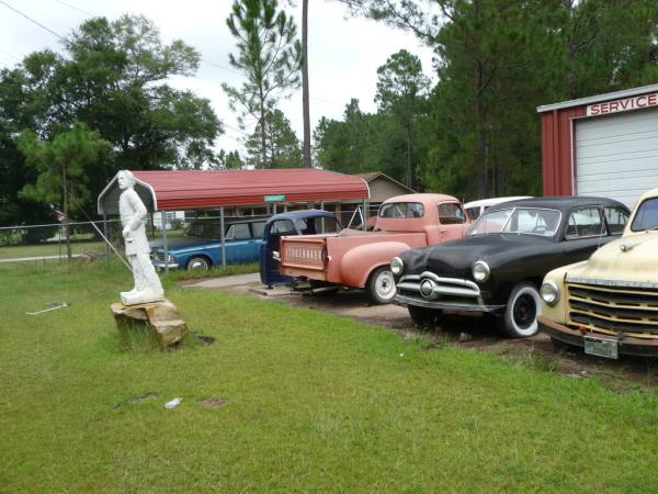 Studebakers By Statue